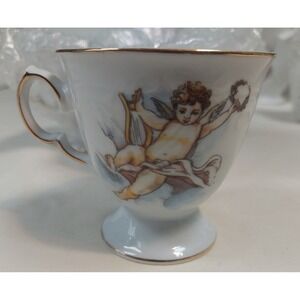 Trisa Porcelain Cherub Teacups Set of 4 Angel Harp Gold Trim Footed Tea Cups